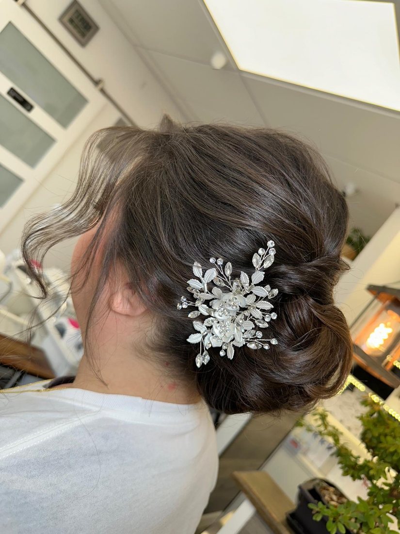 Low bun with a hair pin